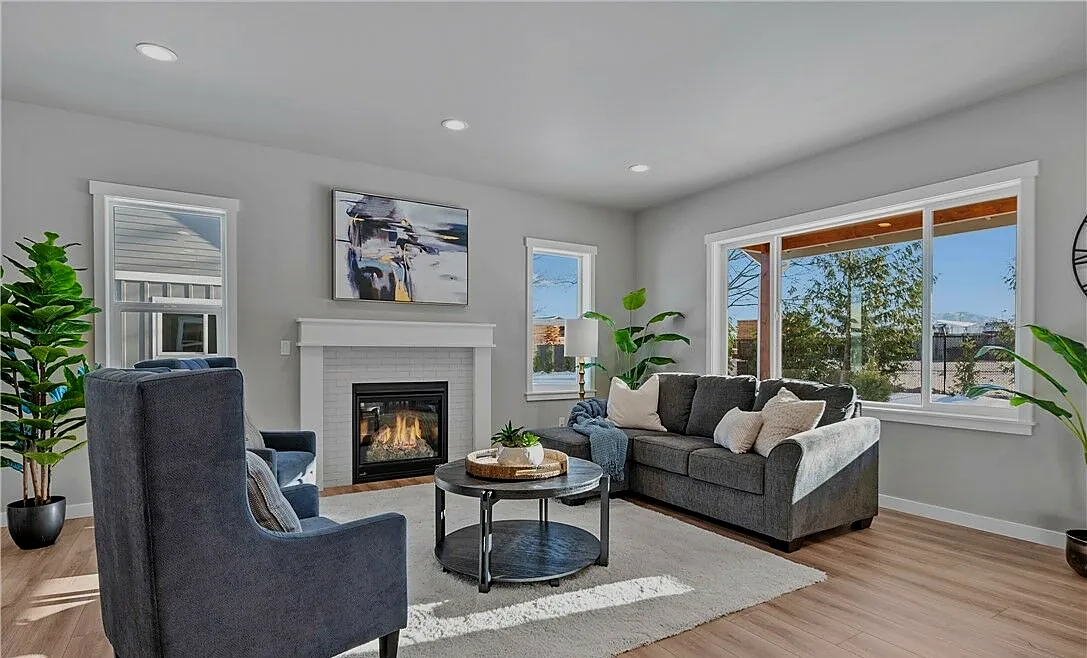 Living room with fireplace and large windows
