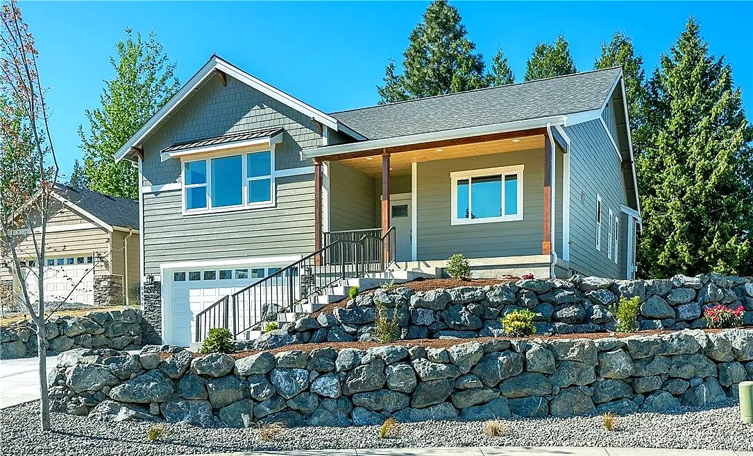 Completed gray home with covered front porch